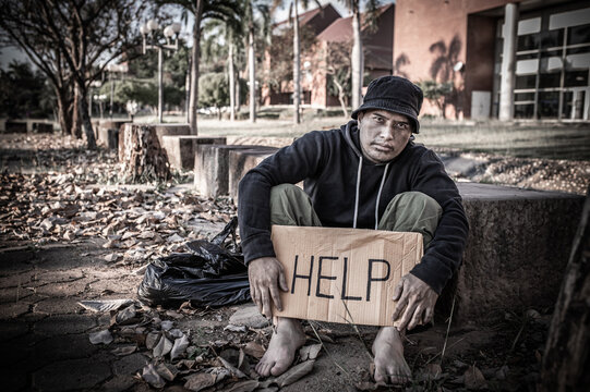 Asian Man Is Homeless At The Side Road,A Stranger Has To Live On The Road Alone Because He Has No Family.