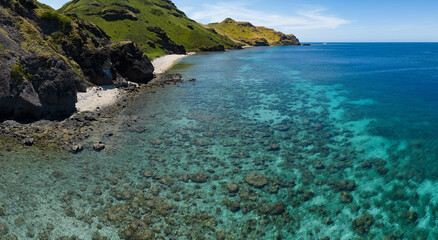 A healthy coral reef fringes the beautiful island of Gili Banta near Komodo National Park in Indonesia. This area, part of the Coral Triangle, is known for its extraordinary marine biodiversity.