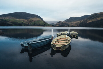 Gorgeous Lake in Snowdonia with rowing boats and perfect reflections. Llyn Nantlle Uchaf