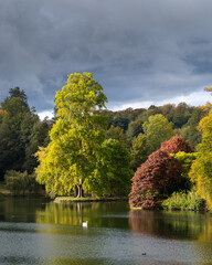 Beautiful English gardens with a lake, Stourhead in Autumn, Wiltshire, Somerset