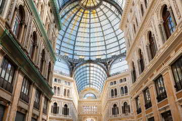 Obraz premium Historic public shopping gallery with old Architecture and Glass Arch Ceiling, Galleria Umberto I. Naples, Italy.