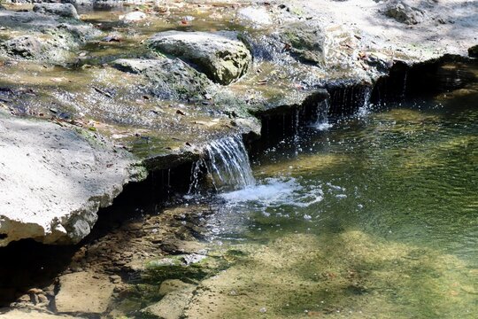 A close view of the small waterfall in the stream.