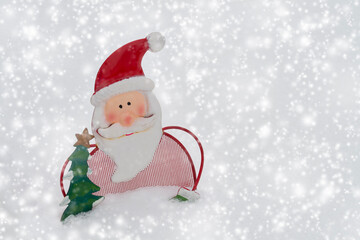 Metal snowman decoration outside in the snow