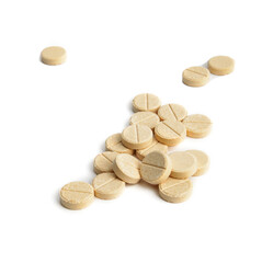 a handful of round beige pills on a white background close-up