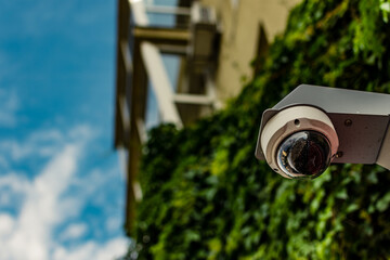 CCTV security camera with 360 view angle at the entrance of a home for surveilling suspicious...