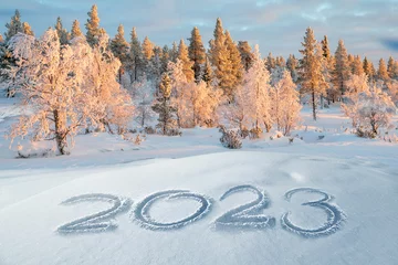 Ingelijste posters 2023 written in the snow, winter landscape greeting card © Delphotostock
