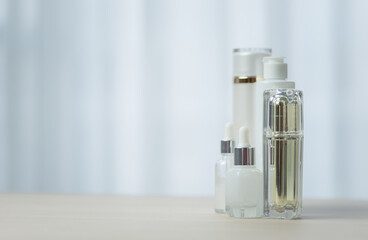 cream bottle, serum on table, beauty concept