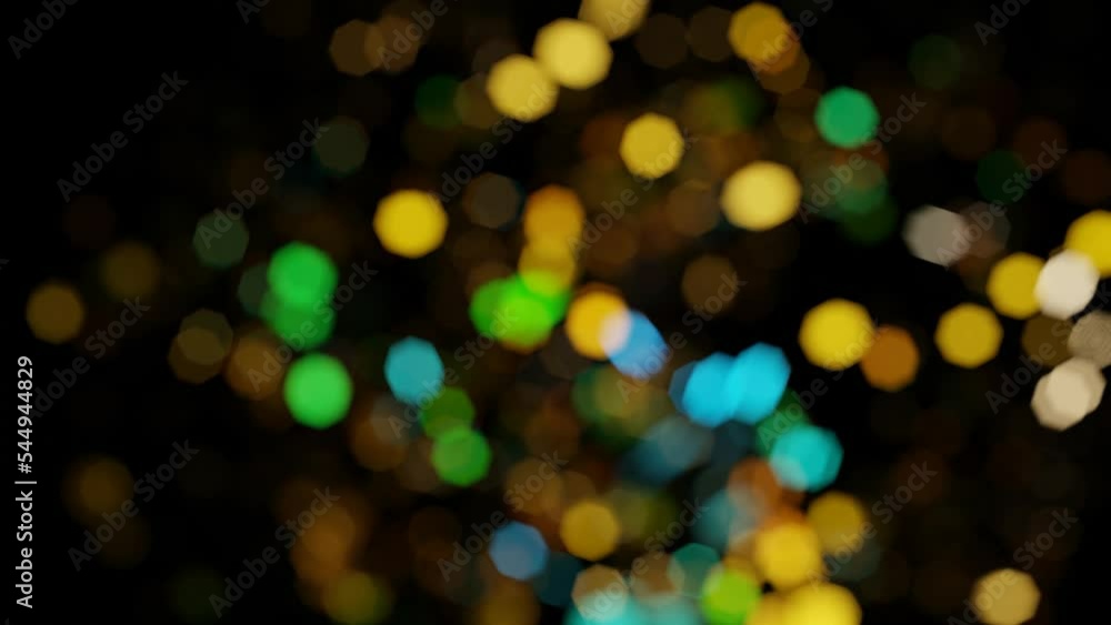 Poster multi-colored bokeh spots moving on a black background. looped animated background. 3d render.