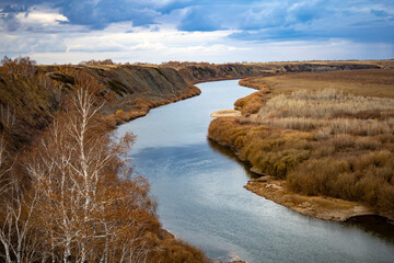 The Ishim River is a riverbed, an autumn landscape.