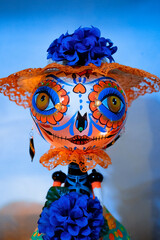 Naklejka premium blue and orange spooky doll for halloween or dia de muertos