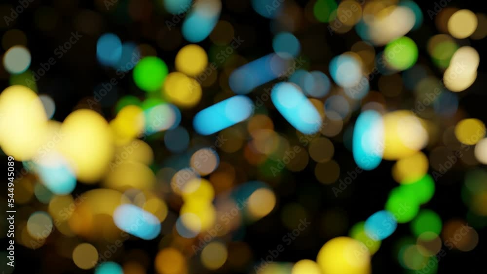 Poster multi-colored bokeh spots moving on a black background. looped animated background. 3d render.
