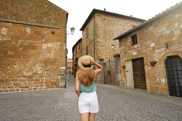 Holidays in Italy. Tourist woman visiting historic medieval town of Orvieto, Umbria, Italy.