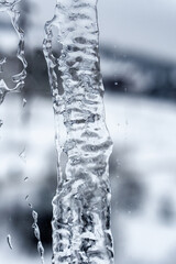 Winter background. Frozen water on the window.