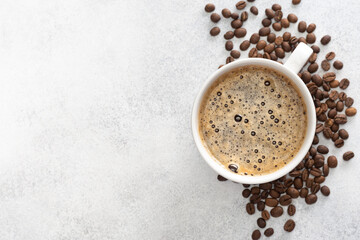 White cup of coffee espresso, ground coffee, coffee beans on white background. Coffee background, top view with copy space.