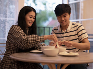 Couple preparing food at home