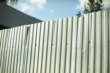 Steel fence in detail. Fence made of metal profile. Durable material to protect against prying eyes. Private territory.