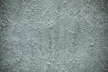 Grey wall in paint. Texture of wall of building. Grey paint. Background from splashes of paint.