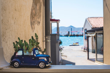 Picturesque view of the city port and sea, Croatian resort small town, decor of a retro car with flowers. Summer vacation