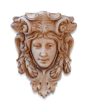 A sculpture or wall mounted Gothic style statue on white background. Decorative artifact face or mask.  