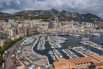 Beautiful panoramic view on Monaco at daytime with Hercules Port (Port Hercule). Principality of Monaco, French Riviera, Western Europe.