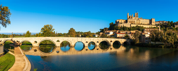 Old bridge over the Orb river and Saint Nazaire cathedral in Béziers, Hérault, Occitanie, France