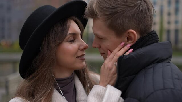 Portrait of a couple in love who rubs their noses