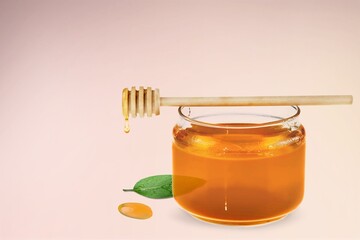 Fresh sweet organic honey in glass jar