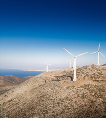 Scenic view of mountain with wind turbines