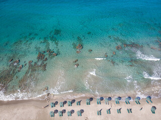 Aerial view of deck chairs and parasols at beach