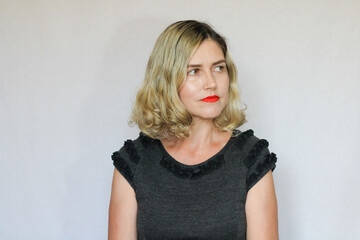 Beautiful middle-aged blond woman on a white background