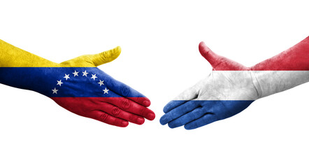 Handshake between Netherlands and Venezuela flags painted on hands, isolated transparent image.