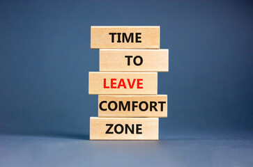 Leave comfort zone symbol. Concept words Time to leave comfort zone on wooden blocks. Beautiful grey table grey background. Business time to leave comfort zone concept. Copy space.