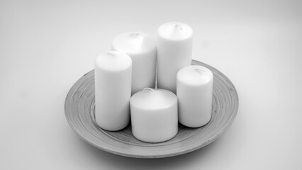Cylinder candles black and white on an isolated background 