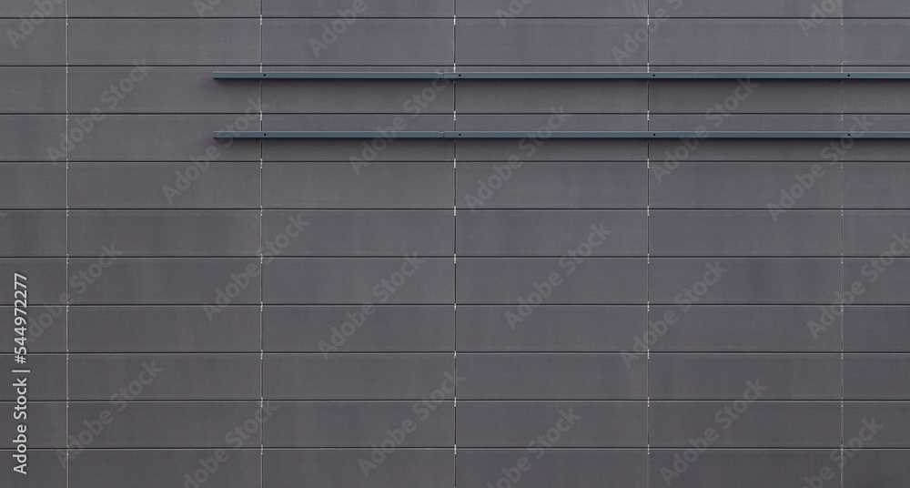 Poster front view of a new and modern wall or building exterior made of gray slabs. abstract high resolutio