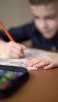 Preschool kid drawing at home. Hobby concept