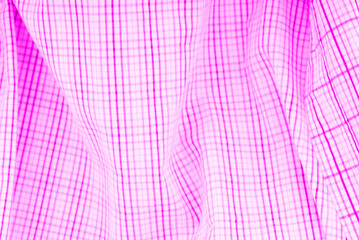 The texture of the fabric is made of squares and a little wriggly. In pink tones