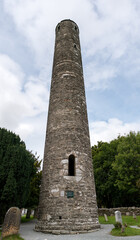 Obraz premium Monastic cemetery of Glendalough, Ireland. Ancient monastery in the wicklow mountains with a beautiful graveyard from the 11th century