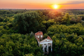 Obraz premium Old ruins of abandoned mansion overgrown by plants, aerial view. Former Verevkin manor, Kursk region