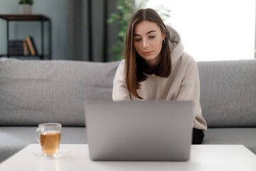 Woman with laptop at home