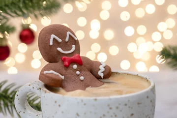 Raamstickers Gingerbread cookie man in a cup of hot chocolate or cappuccino © azurita