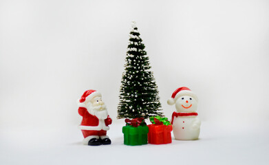 christmas card: santa claus, snowman, fir-tree and gifts on a white background. the concept of celebrating christmas and new year, congratulations on the holiday and giving gifts