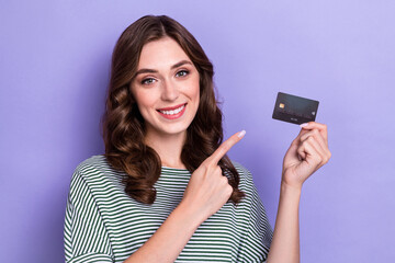 Fototapeta premium Close up photo of adorable glamour lady hand hold direct plastic card recommend bank service isolated on purple color background