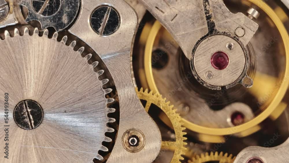 Poster clock mechanism close-up. inside the clock. close up of cogwheels in clockwork
