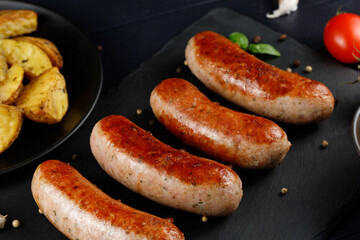 Fried sausages in a restaurant. Tasty and hearty meat dish.