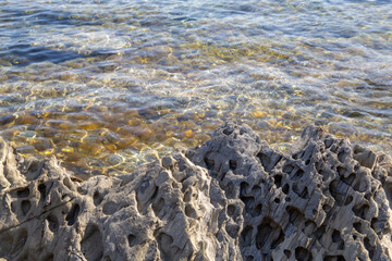 rocks with sales details and inlays of various minerals, natural forms in rock formations