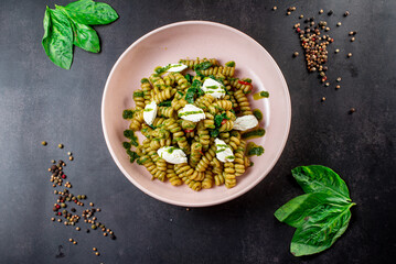 Fusilli pasta with feta cheese, dried peppers and parsley. Shot