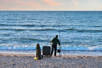 A fisherman catches fish from the sea with a line. Fisherman's equipment.