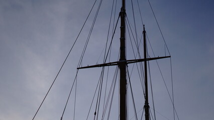 mast and veil silhouette against the sky