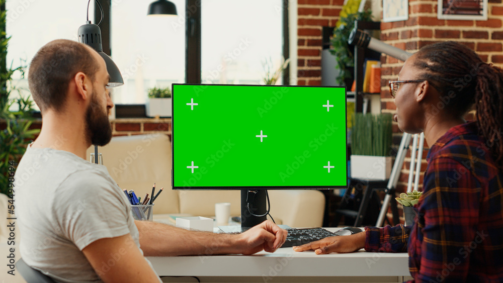 Aufkleber diverse people working with greenscreen monitor on computer, analyzing isolated chroma key on blank 