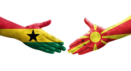 Handshake between North Macedonia and Ghana flags painted on hands, isolated transparent image.